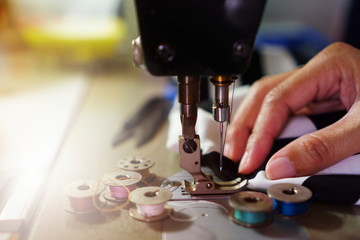 closeup hand of sewing machine