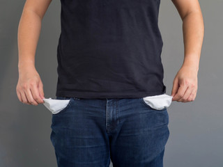 man showing his empty pockets.No money concept