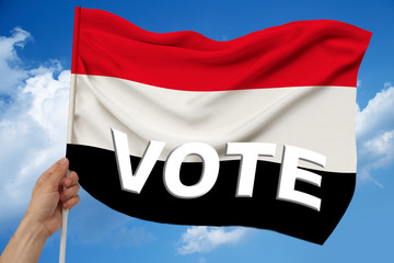 beautiful colored national flag of state of yemen on fabric with technological modern pattern,, concept for tourism, economy and politics, close up