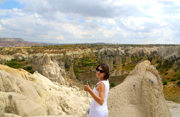 Naklejka premium Young girl traveller standing in the valley of Cappadocia Turkey.