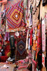 Obraz premium Traditional colorful rugs and carpets are decorated orientally in a carpet store in Cappadocia Turkey.