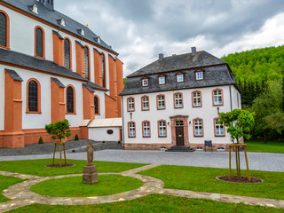 Old building next to St. Salvator Basilica, the former abbey church of the Pruem Benedictine Abbey at Pruem, Germany, parish house