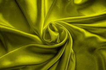 yellow silk delicate fabric twisted and folded in drapery