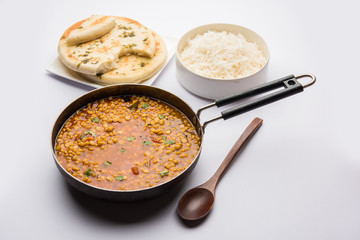 Chana Dal fry or Split Bengal Gram tadka served in a bowl or pan, selective focus