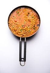 Chana Dal fry or Split Bengal Gram tadka served in a bowl or pan, selective focus