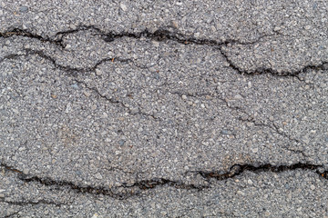 Obraz premium Cracked Old Weathered Asphalt Texture