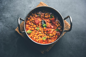 Chana Dal fry or Split Bengal Gram tadka served in a bowl or pan, selective focus