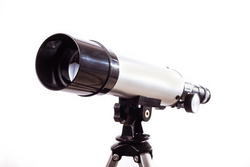 telescope on a white background laid on wooden board