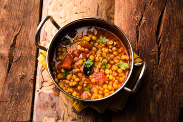 Chana Dal fry or Split Bengal Gram tadka served in a bowl or pan, selective focus
