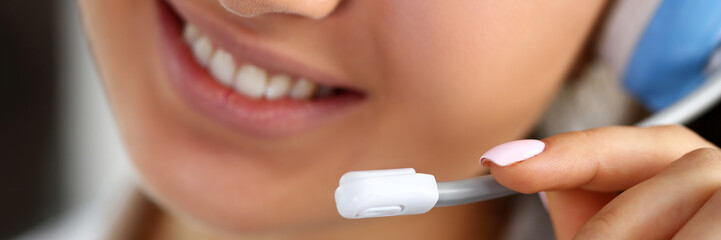 Call centre clerk at work hold in hand mic closeup. Workplace employment effective mediation...
