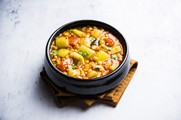 Lauki / Doodhi Chana Dal Subji or Bottlegourd Gram Curry, served in a bowl.selective focus