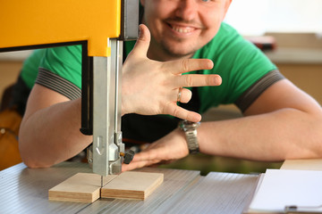 Happy smiling worker wearing yellow hard hat shows four fingers portrait. Manual job workplace DIY inspiration fix shop hard hat industrial education profession career