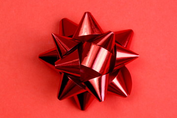 red packing bow on a red background
