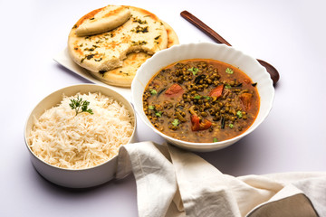 Whole Green Moong Dal fry / Whole Mung bean Tadka served in a bowl. selective focus
