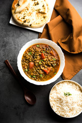 Whole Green Moong Dal fry / Whole Mung bean Tadka served in a bowl. selective focus