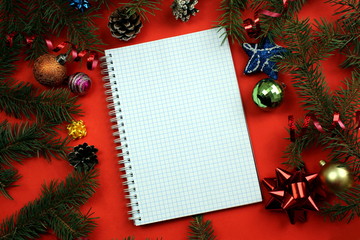 Fototapeta na wymiar notebook lies on the background of Christmas decoration