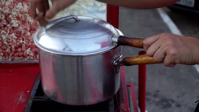 Street Vendor Making a Fresh Batch of Popcorn