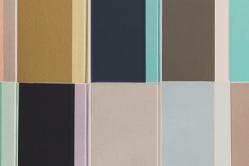 Arrangement of multicolored hardback books