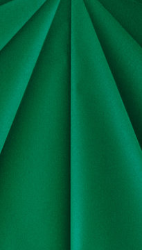 Close up of folded green origami paper