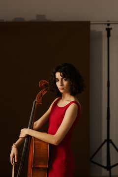 Beautiful young woman with cello