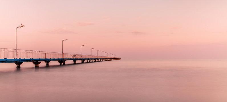 The Pontoon Bridge Mamaia at sunset.(Pasarela) Dock on the Beach