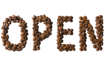A word open laid out of roasted fragrant coffee beans on a white background