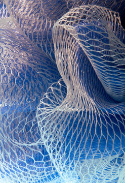Closeup of a blue and white mesh fabric