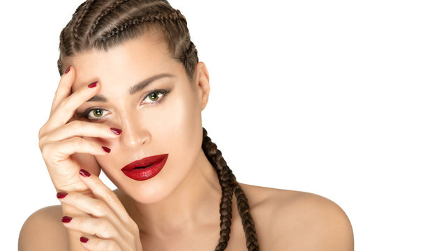 Beauty face woman with braided long hair and bright makeup, red lips and manicure