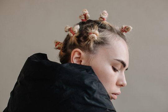 Profile portrait of woman with weird hairstyle