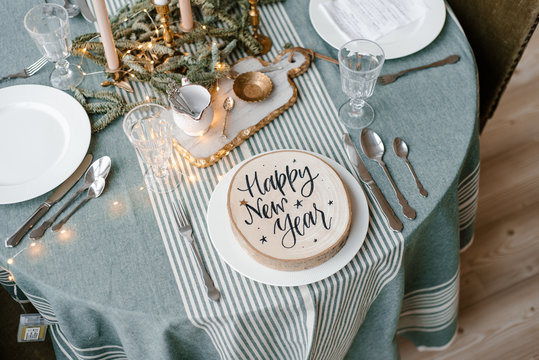 Wood Circle With Happy New Year?inscription On Plate On Table