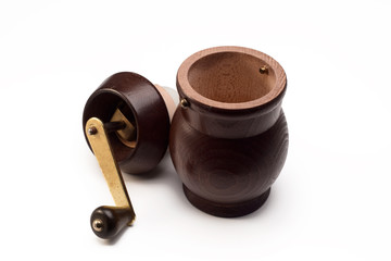 brown manual coffee grinder on a white isolated background.