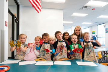 Elementary School Students Making Paint Handprints