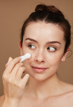 Gorgeous woman using roller