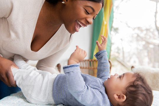 Mother making baby giggle