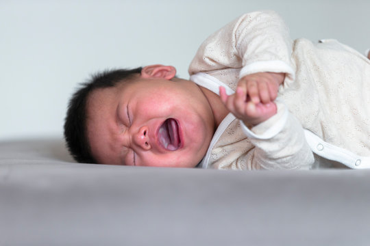 Newborn baby crying at home