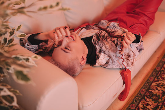 Relaxing woman with retro telephone