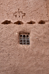 Lattice window in a traditional clay house, Merzouga, Morocco.