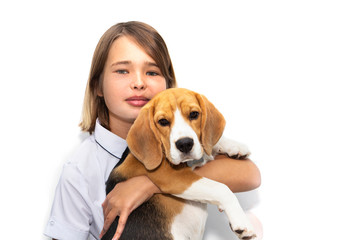 Portrait of a teenage girl with a dog breed Beagle.