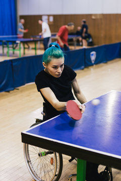 Woman in wheelchair playing table tennis