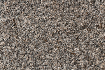 A beautiful texture of natural gray and yellow granite stone surface in the photo
