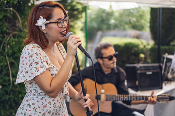 female jazz singer singing on stage 