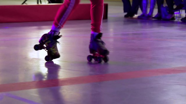 View Of Lower Half Of Adult Running Man Dance On Roller Skates Indoors 
