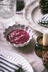 Fototapeta premium Traditional Thanksgiving cranberry sauce. Homemade red sauce for Thanksgiving and Christmas turkey dish.