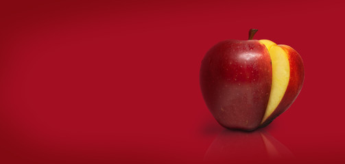 Sliced apple isolated on red background