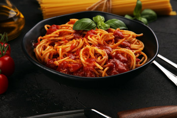 Plate of delicious spaghetti Bolognaise or Bolognese with savory minced beef and tomato sauce garnished with parmesan
