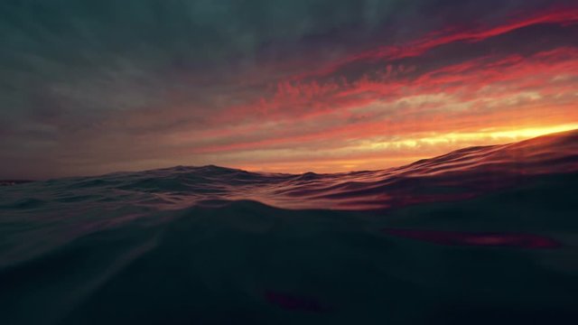Sea wave close up, low angle view, slow motion sunrsie shot