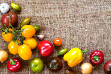Assortment of colorful fresh vegetables on sackcloth background