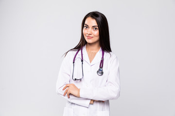Beautiful young doctor with stethoscope isolated on white background