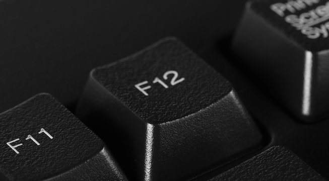 F12 key, computer keyboard background and texture, side view