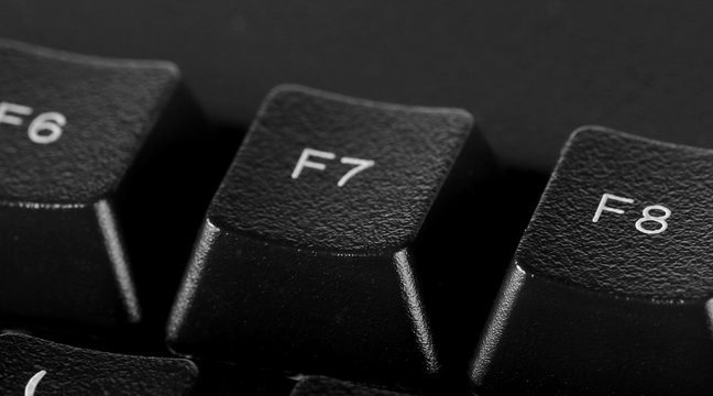 F7 key, computer keyboard background and texture, side view